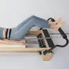 ELEMENTS Lumbar Belt in use on Pilates Reformer