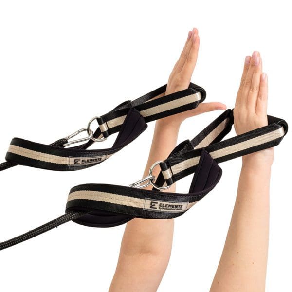 ELEMENTS Pilates Loop and Roll Straps in use, black and gold with beige neoprene lining