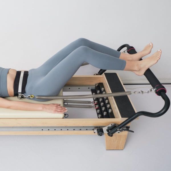 ELEMENTS Lumbar Belt in use on Pilates Reformer