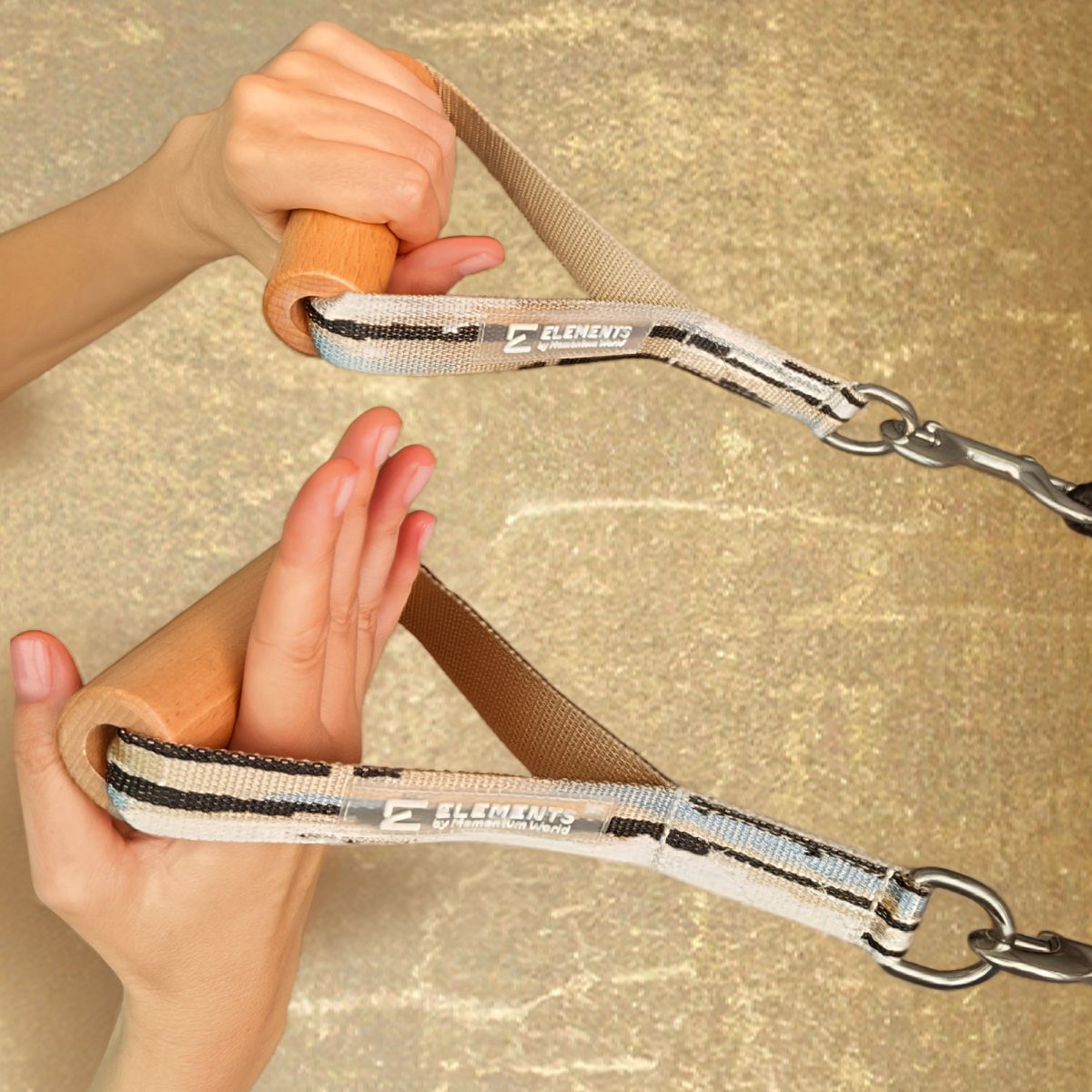 ELEMENTS-wooden-roll-handles-mirage-gold-collection ELEMENTS® Wooden Roll Handles in use in the hands on a pilates reformer in front of a golden wall